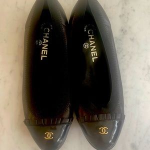 Chanel black leather, patent and gold details. NWOT, never worn. 36.5